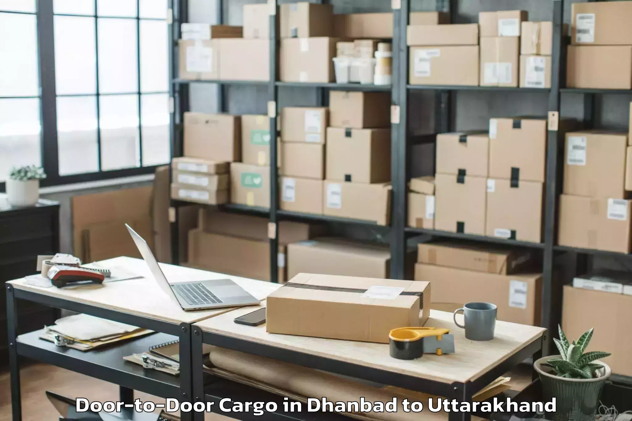 Dhanbad to Rajgarhi Door To Door Cargo Booking